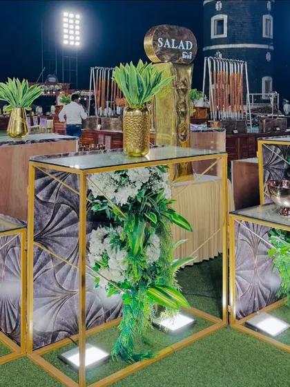 My modern salad bar, featuring geometric gold stands and fresh floral decor, offering a chic and healthy dining option.