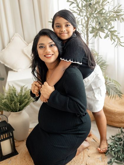 A beautiful family portrait capturing the joy of a second pregnancy. The love and excitement of the older sibling adds such a special warmth to this maternity session.