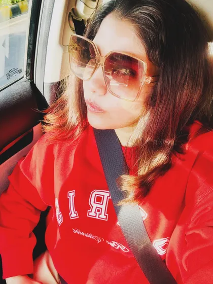 Another car selfie in the red sweatshirt, with a more pensive look.