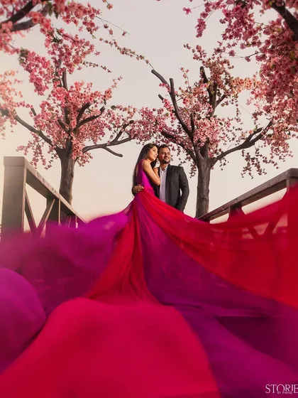 For couples wanting a touch of fairytale magic, I create high-fashion, dramatic portraits. The flowing gown and cherry blossom backdrop make for an unforgettable, artistic pre-wedding photograph.