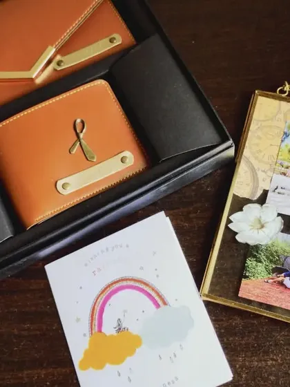 A full view of the couple's wallet combo and handmade frame. I can add custom names and charms to the wallets to make them a unique anniversary or wedding gift.