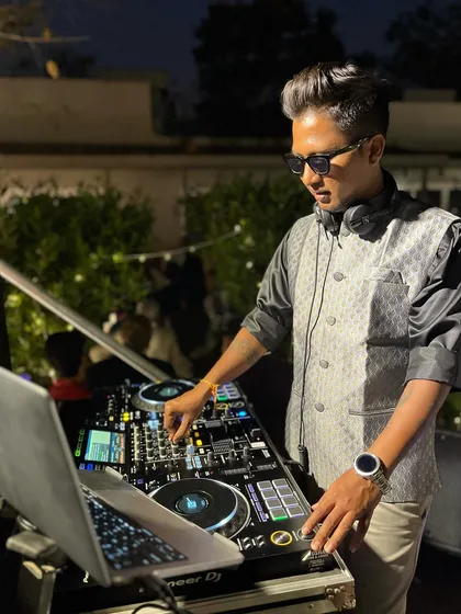 Mixing live during a Baraat procession. I stay connected to the crowd's energy, adjusting the music to keep the party going strong.