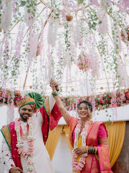 A triumphant and happy moment as the couple celebrates their union.