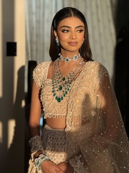 The bride looks radiant and happy in this beautiful portrait.
