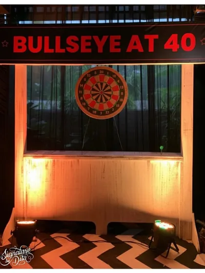 I believe in adding interactive elements to parties. This custom 'Bullseye at 40' dartboard station provided a fun activity for guests and reinforced the milestone birthday theme.