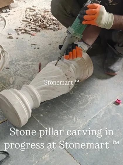 An artisan carves intricate patterns onto a stone pillar. This level of detail is what makes each piece a unique work of art.