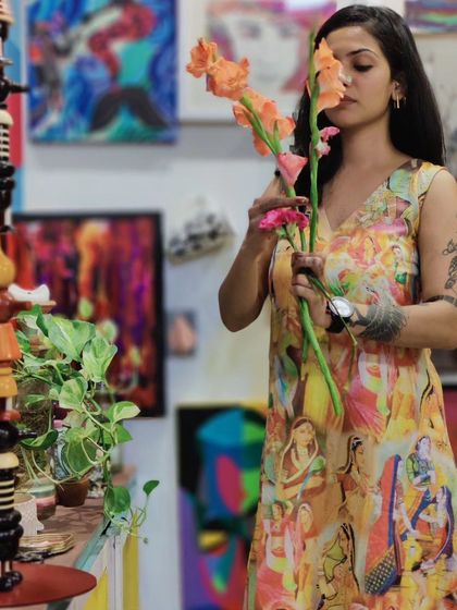 Me in the studio, surrounded by flowers and art. A moment of connection with the natural and created beauty that fuels my work.