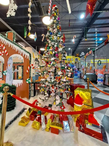 Our beautifully decorated Christmas tree, surrounded by presents, brings holiday magic to the play zone.