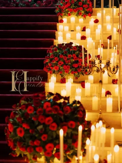 Detail is key in creating a luxurious feel. Here, you can see the rich texture of the red carpet against the warm light of the candles and the deep red of the rose bouquets. I use high-quality elements to ensure the entire setup feels opulent and thoughtfully designed.