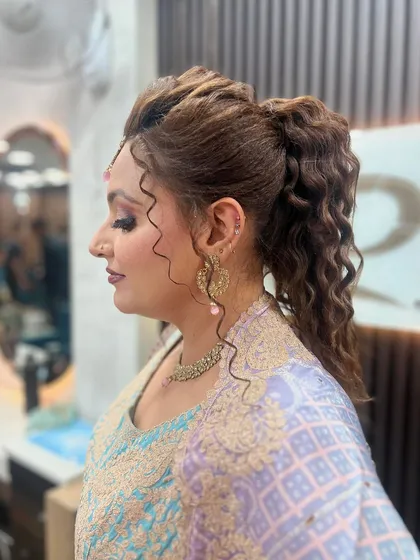 Another angle of the high ponytail, showing its volume and texture from the side.