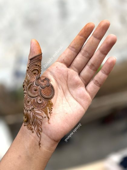 The thumb and wrist detail of a design I did for myself, showcasing intricate patterns.