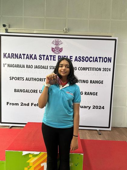 Rishika with her bronze medals from the Air Pistol Women's event.