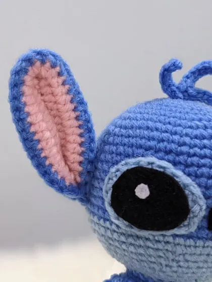 A detailed close-up of Stitch's ear, showing the fine crochet work.