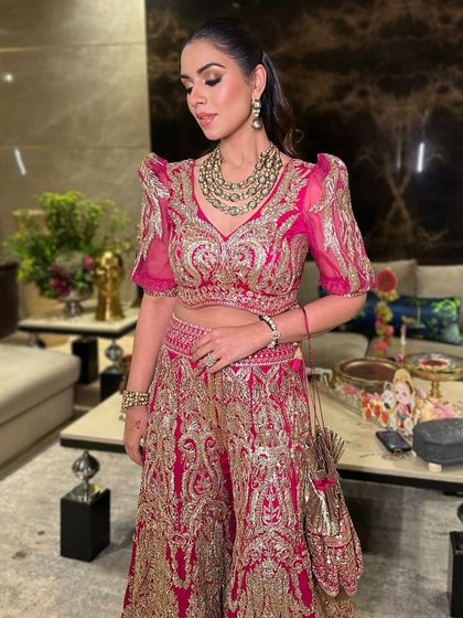 Pretty and shining bright in festive pink. This look redefines glam goals with a bold eye and radiant skin, perfect for a wedding celebration.