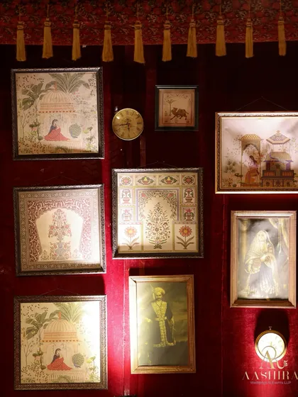 To add a layer of heritage, I curated a gallery wall of traditional Indian art against a rich velvet backdrop, creating a corner that whispered stories of a regal past.