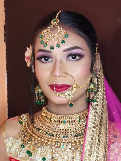 A full-face portrait showcasing the complete, glamorous bridal look.