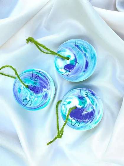 These are my soap-on-a-rope products! The swirled blues and purples are beautiful, and they are so convenient to hang in the shower to dry.