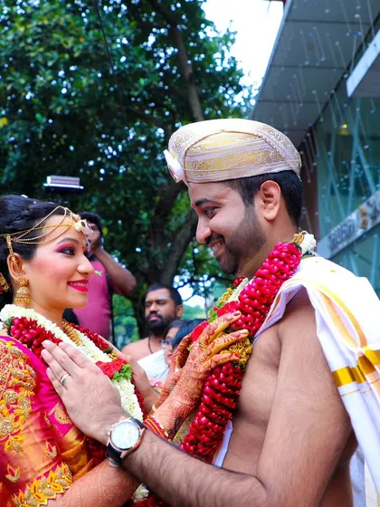 A tender moment right after the main ceremony. The groom's gentle touch and the bride's happy gaze create a beautiful, candid portrait.