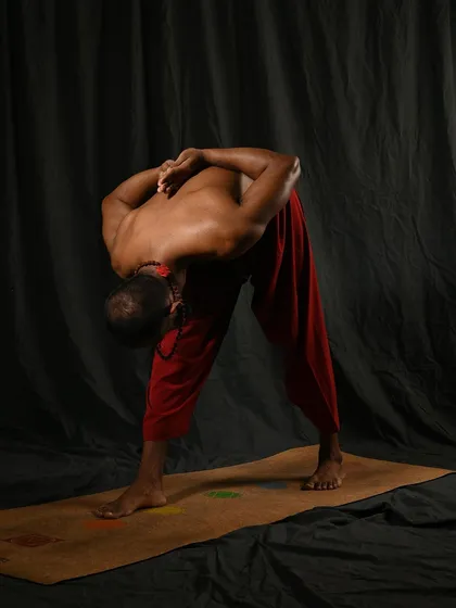 A closer look at Parsvottanasana, or Pyramid Pose. This posture is an intense side stretch that lengthens the spine and hamstrings while challenging your balance. The reverse prayer position of the hands, or Paschima Namaskarasana, further opens the shoulders and chest.