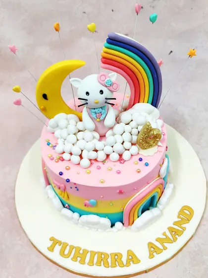 We bring dreams to life with this Hello Kitty Rainbow Cake. This design combines a beloved character with a vibrant, magical world of rainbows, moons, and clouds, demonstrating our skill in creating colorful, multi-element cakes that are a feast for the eyes.