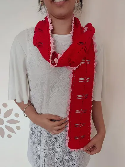 Modeling the scarf shows how it can be styled and how the dragonfly cutouts look when worn.