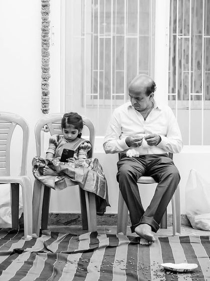 A quiet moment between a grandfather and his granddaughter, captured in black and white. These documentary-style shots preserve precious family memories.