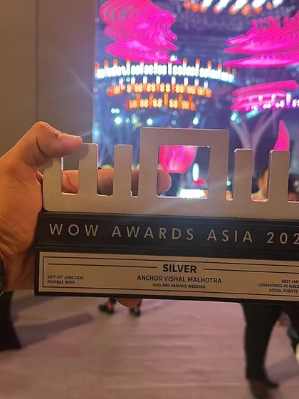 A close-up of the silver WOW Awards Asia 2025 trophy. Every award represents countless hours of hard work and the amazing memories created at each wedding.
