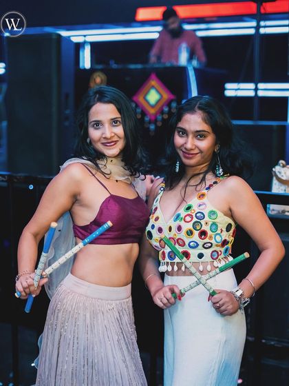 Partygoers enjoying the Dandiya night at White Lotus Club. It's fantastic to see everyone dressed up and enjoying the festive music.