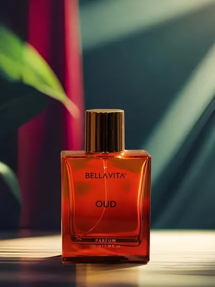 A beautifully lit product shot of a Bella Vita perfume bottle, using shadows and highlights to create a luxurious and moody feel.