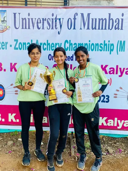 Our women's team celebrates winning the third-rank trophy at the University of Mumbai Interzone Archery Competition.