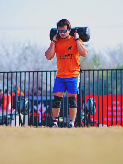 Carrying a heavy sandbag at The Yoddha Race. This is a test of functional, real-world strength. We build this kind of carrying capacity in our training.