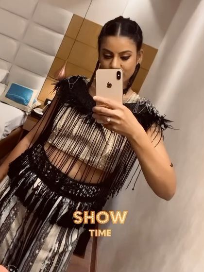 It's showtime! A quick mirror selfie before heading out to perform. This captures the excitement and preparation that goes into every single event.