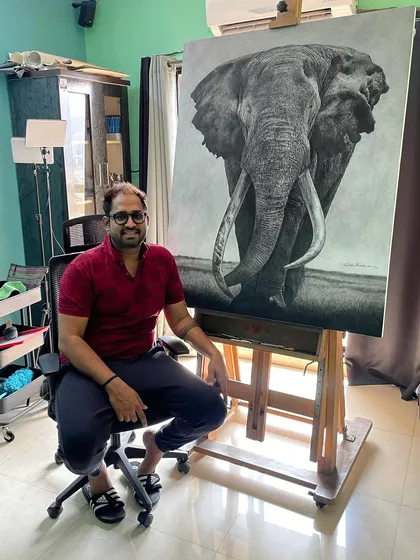Here I am in my studio with the completed 'Gajraaj' painting. This photo helps to show the impressive size of the 40 by 50 inch canvas and the level of detail that goes into such a large-scale wildlife portrait.