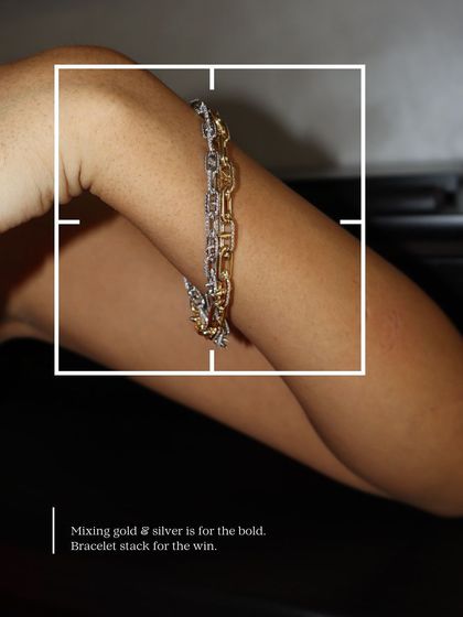 Mixing gold and silver is for the bold. This bracelet stack for the win features two Cuban link bracelets, one in gold and one in silver, layered for a modern, edgy look.