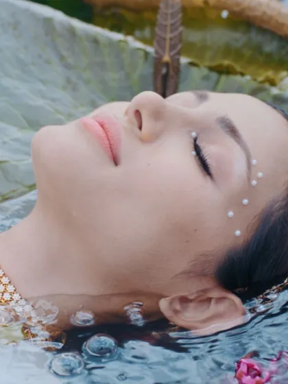 Serene beauty in the water. For this shot in the Bhima campaign, I created a waterproof, ethereal look with delicate pearl accents on the face, ensuring the makeup stayed flawless.