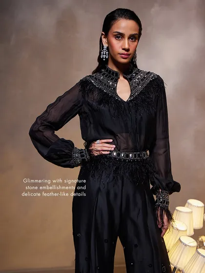 The Amore Pant Set, glimmering with signature stone embellishments and delicate feather-like details, creating a truly unique and luxurious look.
