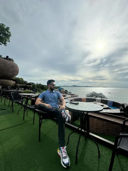 Taking in the scenic coastal views in Thailand. These moments of reflection are important for maintaining focus and perspective in a demanding profession.