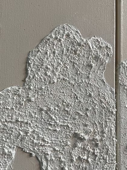 A macro shot of the rough, concrete-like texture I create as a base for my gold leaf artworks. The texture itself is a key part of the design.