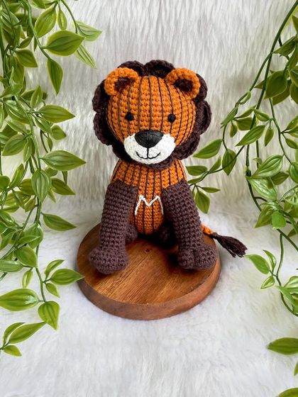 A unique lion created from a child's drawing! I love bringing your creative ideas to life. This striped lion with the initial 'M' is a truly one-of-a-kind creation.