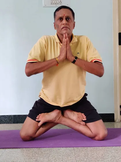 This is Gorakshasana, a balancing seated pose that requires significant hip flexibility. We work on such postures to develop control over the body.