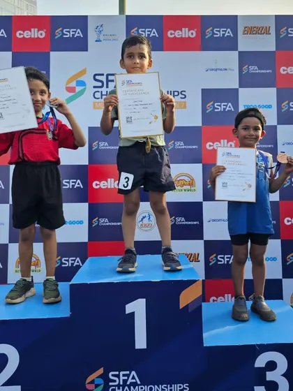 A young champion's first taste of victory. One of our junior athletes stands proudly on the podium after securing a medal in the 50m sprint at the SFA championships.