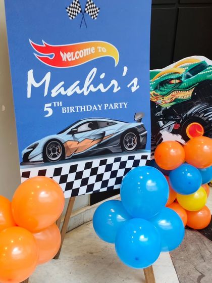 The welcome sign for a Hot Wheels 5th birthday party, featuring a cool race car graphic.