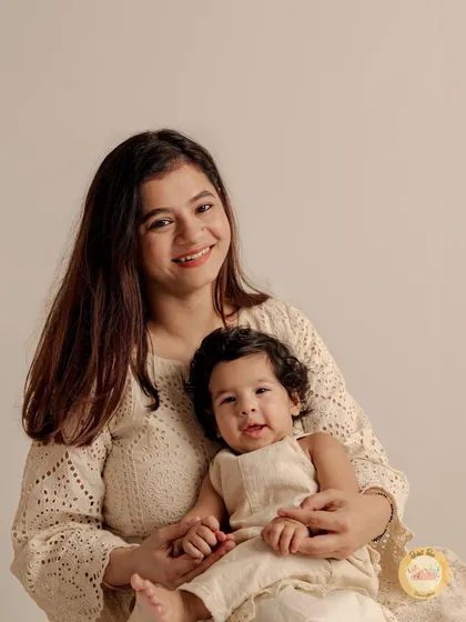 The sweet connection between a mother and her six-month-old baby. We capture these quiet, tender moments during our milestone sessions.