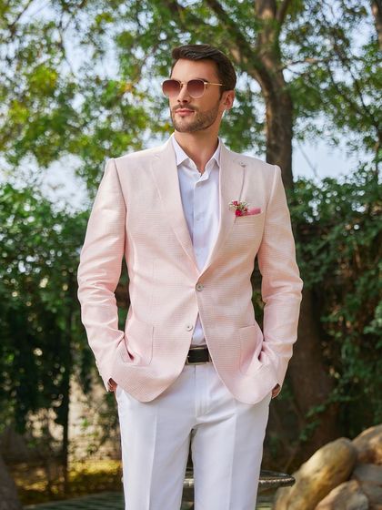 A final look at the Rose Quartz linen jacket, a testament to sartorial tailoring and contemporary color selection. It's a key piece in my summer collection for the modern man.