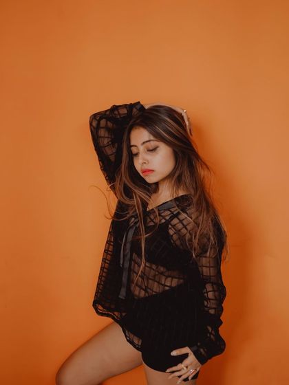 A moody and fashionable pose from the same studio session. I work with models to find poses that feel both natural and powerful.