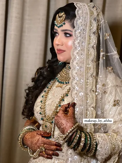 This bride's white and green lehenga is so elegant. I created a soft, glowing makeup look with a focus on her eyes.