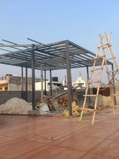 The basic metal framework of a pergola under construction in Gurugram, Sector 4.