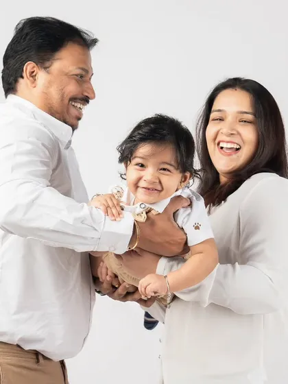 The pure, uncontainable joy of playing with your child. The laughter in this photo is contagious and shows the beautiful connection this family shares.