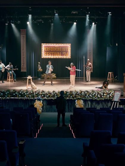 A wide shot of the stage from the Casio 'Performing Arts Festival' ad. My job was to ensure the entire cast's wardrobe felt cohesive and authentic to a college setting, from the performers to the stagehands.