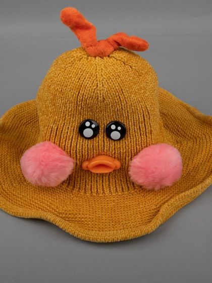 Another view of the funny and cute mustard-yellow duck hat.